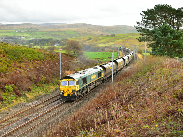 Freightliner's 66513 powers up Shap at the classic WCML location of Greenholme