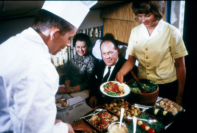 A chef serving food at a DC-8