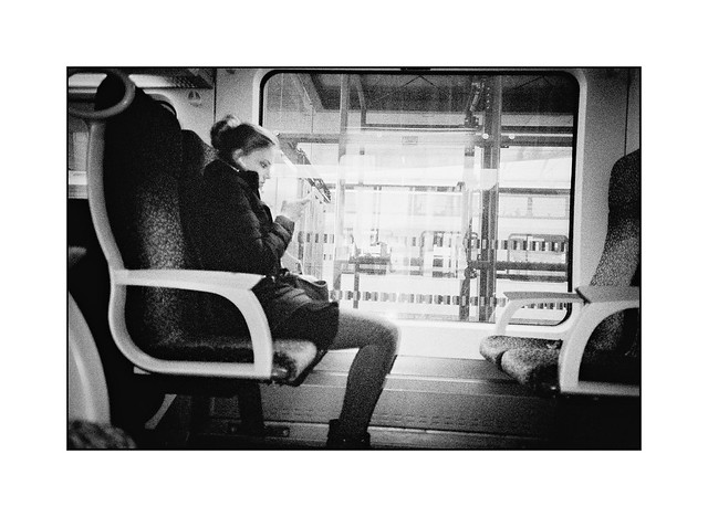 Girl, cellphone, train