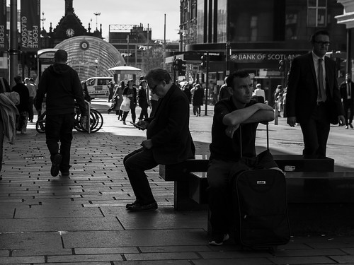 life street city uk travel light shadow people urban blackandwhite bw white man black detail men travelling texture face mobile composition canon bench four mono scotland living blackwhite eyecontact sitting phone darkness faces natural humanity outdoor expression glasgow candid culture streetphotography streetlife scene human shade 7d posture society depth tone facial candidstreetphotography