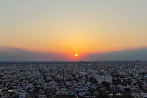 city blue houses sunset sky orange sun india yellow sunrise buildings dawn star colorful dusk indian aerialview flats planet hyderabad population packed crowded moulaali