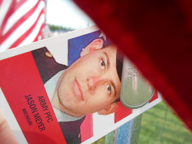 each flag bears a photograph and dog tags of one of the heroes who gave their lives since 9/11/01 serving their country