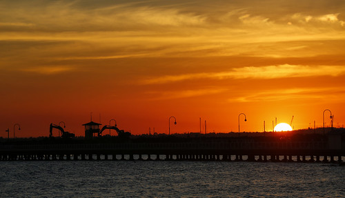 sunset people sun water pier construction jetty melbourne stkilda