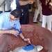 05/01/2016 - 1:41pm - Papa Tortuga (Fernando Manzano) overseas the installation of a transmitter, conservationists from Aquarium of Veracruz, onto a turtle whose nest is protected by Vida Milenaria.  
