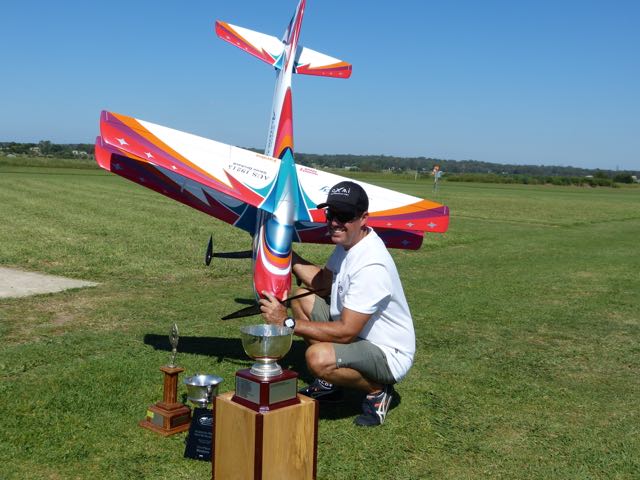 Glenn Orchard with model & trophies. Model is a NTS (Naruke Tech Service), Acuracy (yes, that’s how it’s spelt) Biplane, powered by a Plettenberg Advance motor, Tx is Futaba 18MZ