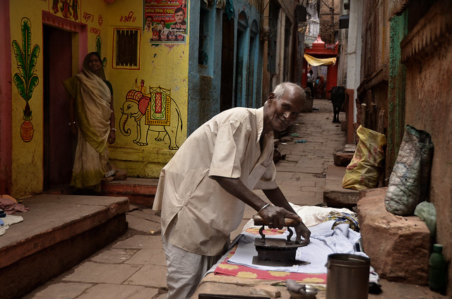 Ironing in the colorful  streets of Varanasi