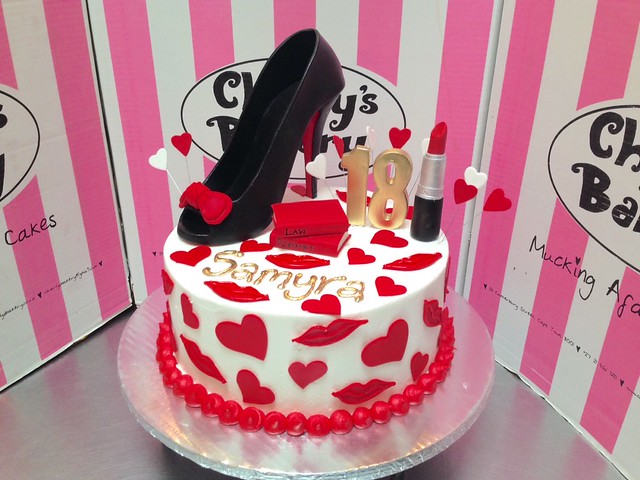 30th birthday cake decorated with 3D peep toe stiletto, 3D lipstick, 3D books, fondant hearts & lips