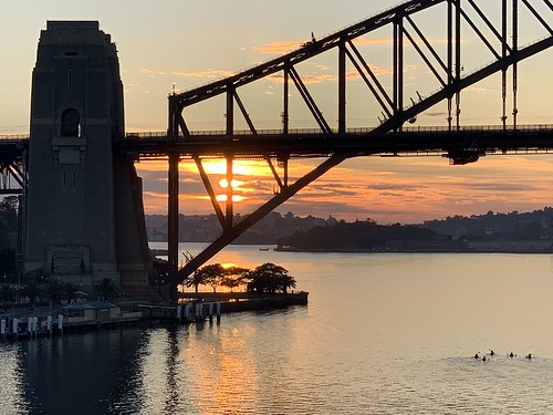 silhouette water kayak sunrise bridge harbour sydney