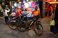 Cyclists at evening market in Pai (Northern Thailand 2018)