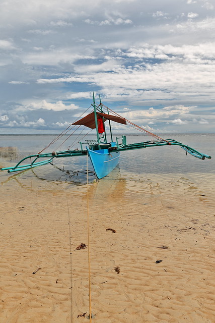 Balangay or bangka boat ashore. Punta Ballo beach-Sipalay-Philippines. 0291