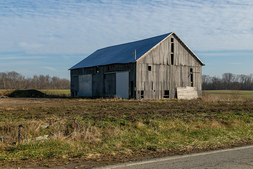 espy building structure ohio unitedstates us barn outbuilding farm agriculture historic vacant abandoned farmland landscape newhope scotttownship browncounty valley trees road pavement clouds vertical woodsiding dilapidated