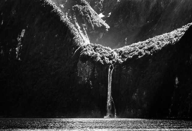 Tourist boat (nearly) under Stirling Falls - Milford Sound