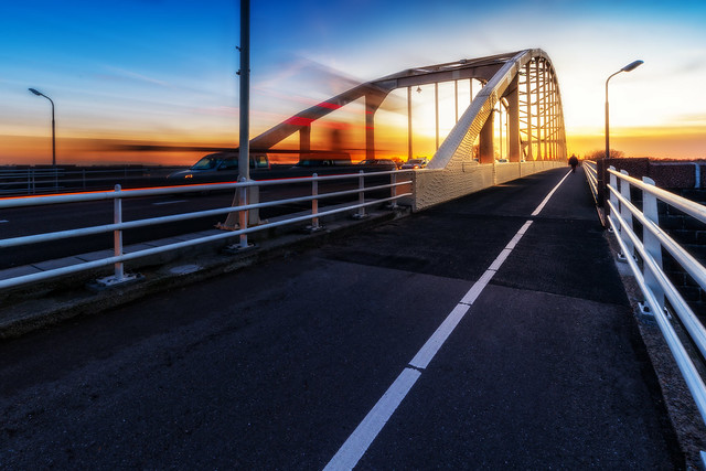 Image of the Wilhelmina bridge. I took this image to test out the IRIX15. It is a splendid lens, but I do not like to use adapted glass on my Sony, hence I send it back. This image is a long-exposure of the traffic on the bridge and a nice lovely sunset.