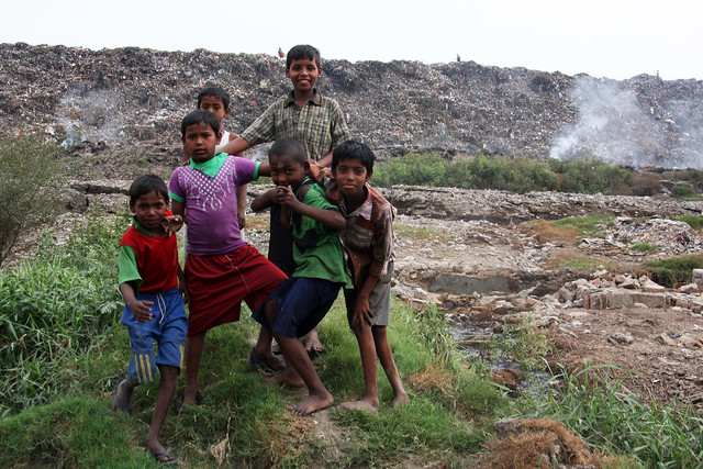 Children at a burning trash site in Kolkata / Calcutta