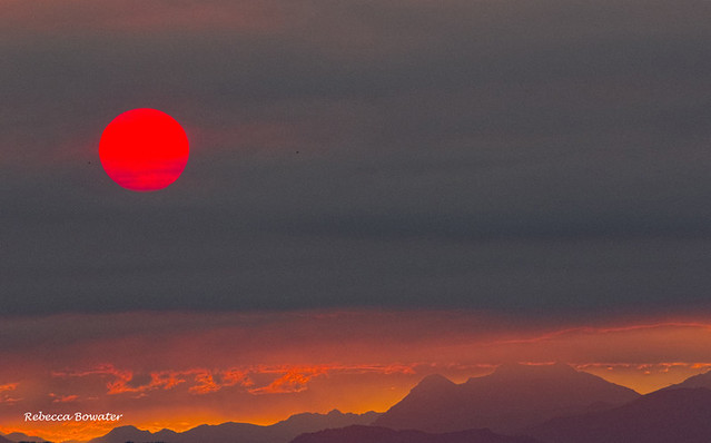 Sun in the smoke at sunset caused from the massive forest fires