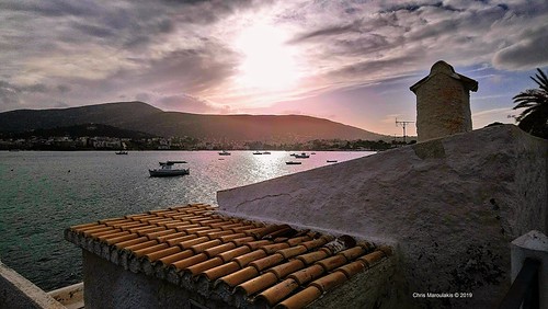 portorafti sunset roofs sea boats attica greece