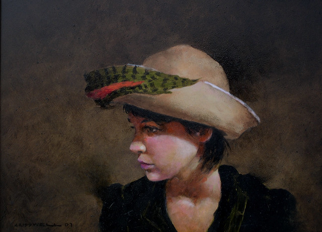 gilrl green feather hat