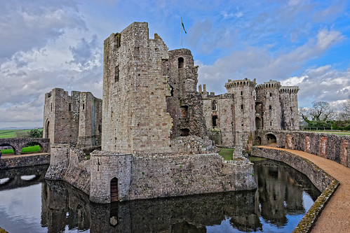 castle monument tower battlement keep moat water reflection wall bridge footpath flag ruin desolation sky cloud raglan wales monmouthshire ghe