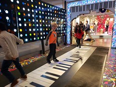 Playing On The Big Piano At Macy's