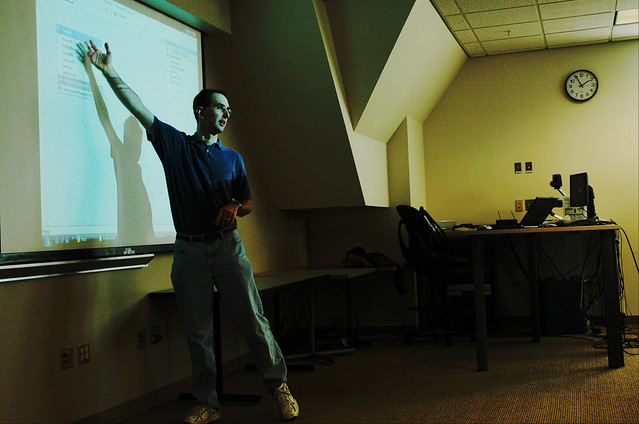 Instructor teaching coding, white board, projection, desk, computers, laptop, iSchool, University of Washington, Seattle, USA