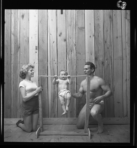 [Bodybuilder Gene Jantzen with wife Pat, and eleven-month-old son Kent] (LOC) | by The Library of Congress