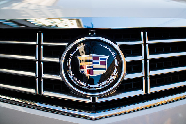 Close-up of CADILLAC sign on a car