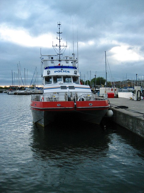 Police Boat moored at the harbour at the main pier , near the coastguard building , Martin’s photographs , Cobourg , Ontario , Canada , June 5. 2007