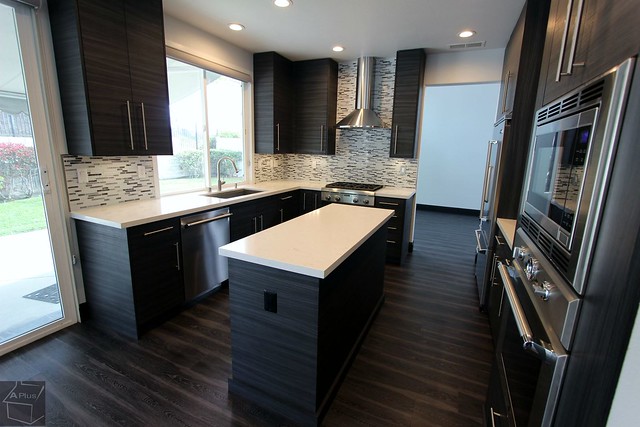 Contemporary style kitchen remodel with modern sophia line cabinets, custom island wood floors in city of San Clemente Orange County http://www.aplushomeimprovements.com/portfolio_page/san_clemente_orange_county_modern_kitchen_design_build_remodel-102/