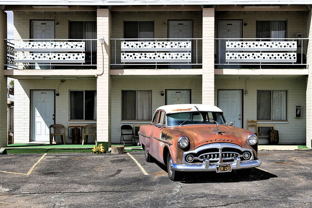 The old car in front of the motel