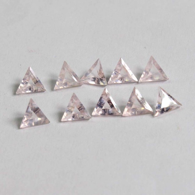 natural ose quartz triangle faceted cut gemstone