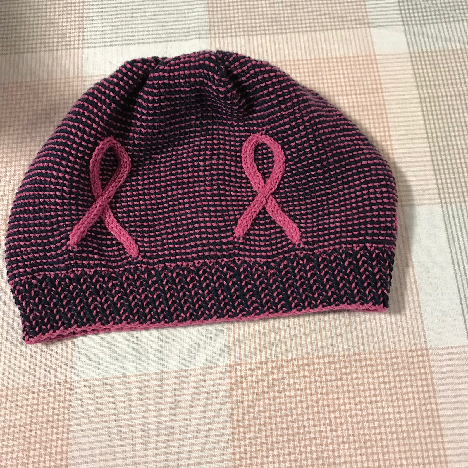 Sandi’s Breast Cancer Awareness hat test knit! Love the blue with pink!