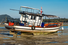 Yachts and boats at low tide, Rawai beach, Phuket island, Thailand