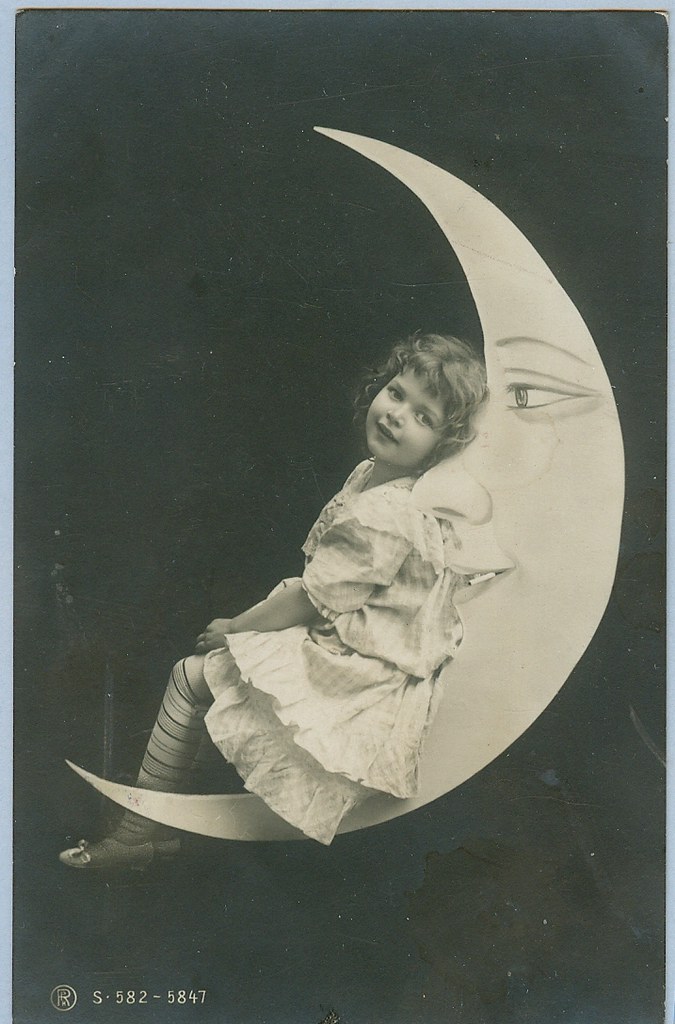 A girl relaxes on the moon postcard