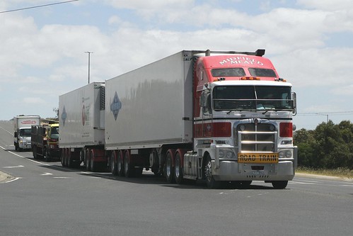 Midfield Meats A-double refrigerated truck displaying 'Road Train' signage on Kororoit Creek Road in Laverton North