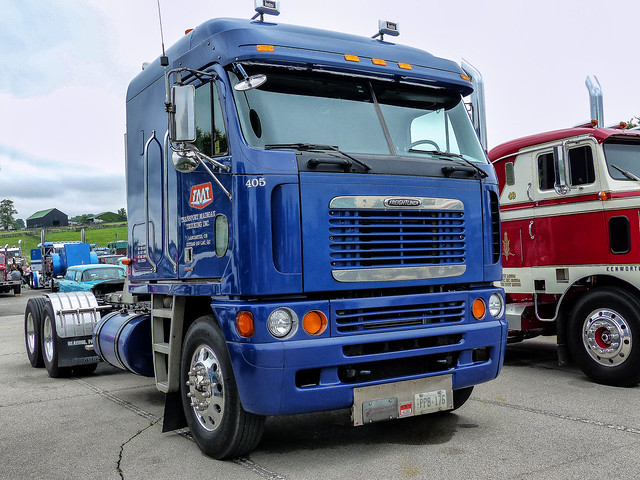 Transport Madigan Trucking's Freightliner Argosy COE Semi Tractor
