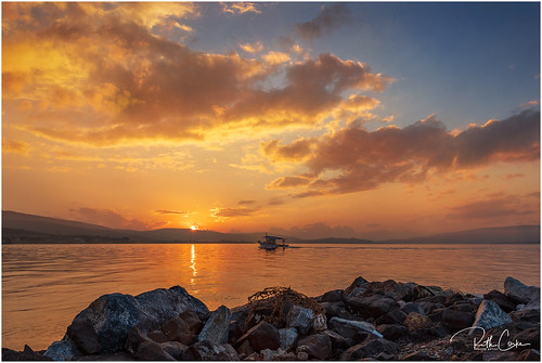 Sunset at Skala Polichnitou by mad_ruth, sky sea sunset boat clouds rocks gold blue seascape