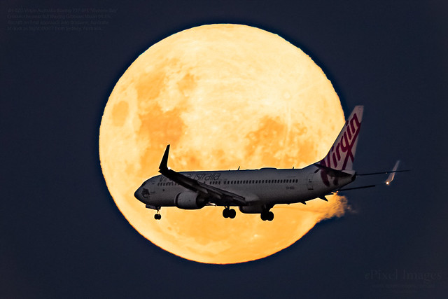 VH-BZG Virgin Australia Boeing 737-8FE 'Vivonne Bay' crosses through the Near Full Waxing Gibbous Moon (99.8%).