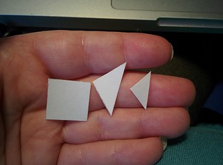 Here are the square, half-square triangle, and quarter-square triangles held in my (admittedly small) hand for a sense of scale. They are astonishingly dainty.
