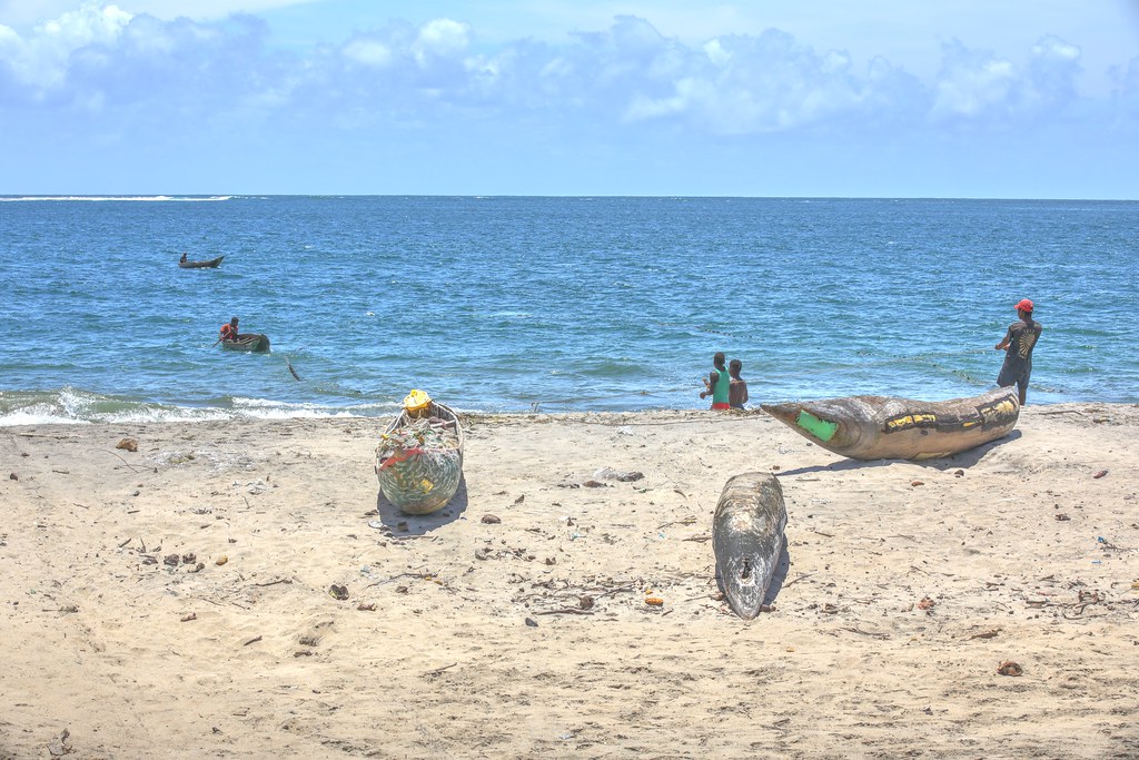 Fishermen,boats and net.