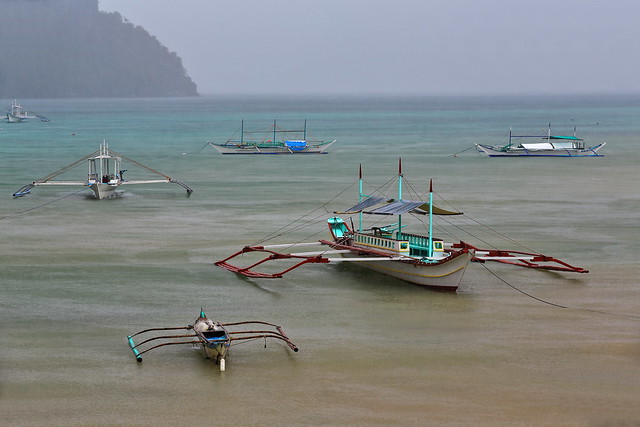 Fishing and tour boats stranded-moored under heavy rain. El Nido-Palawan-Philippines-0818