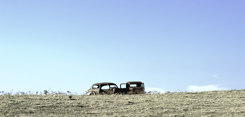 abandonedvehicle sky clouds horizon pasture rust shadows cars weathered oxidation faded