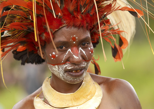 Chimbu Tribe Woman With Giant Headdress Made Of Eagle Feathers During Sing Sing In Mount Hagen, Western Highlands, Papua New Guinea