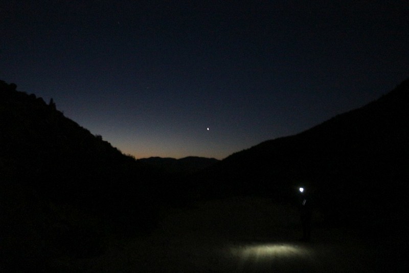 It's 6 AM and the sky is just starting to brighten as we near our car, with Venus and the moonlight