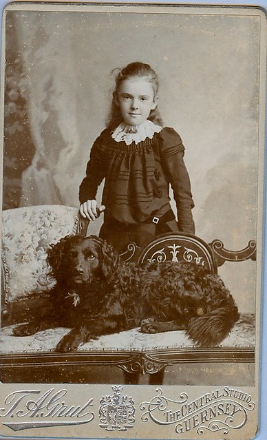A girl with her pet dog posed handsomely