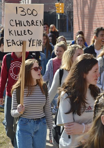 After walking out of class to protest gun violence many students in Boulder, Co marched to a downtown rally where they called for stronger gun control laws. | by desrowVISUALS.com