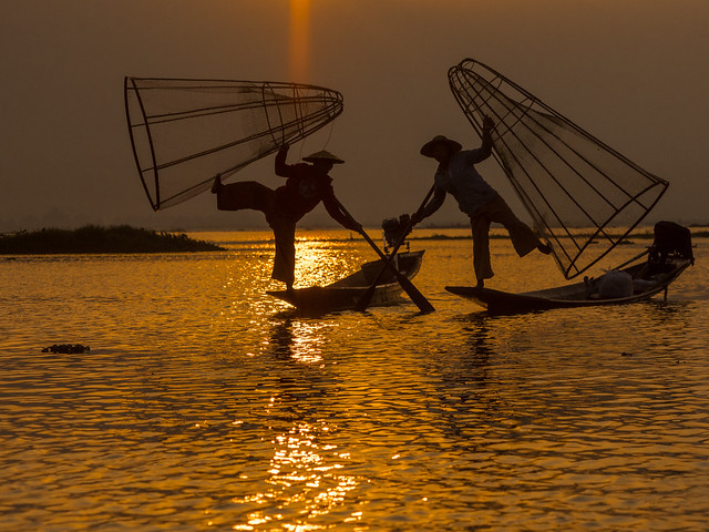 Fisherman at sunset Isle Lake Myanmar