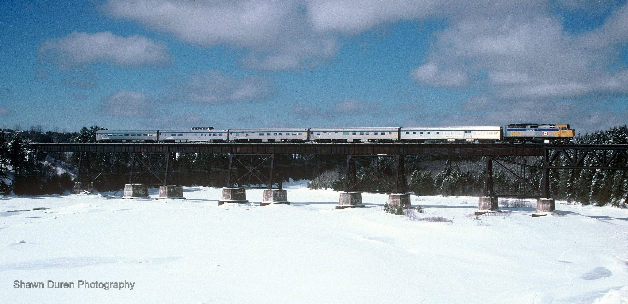 VIA Rail Train #16, the Chaleur crosses the trestle at Grande-Rivière, Quebec on March 22, 2004.