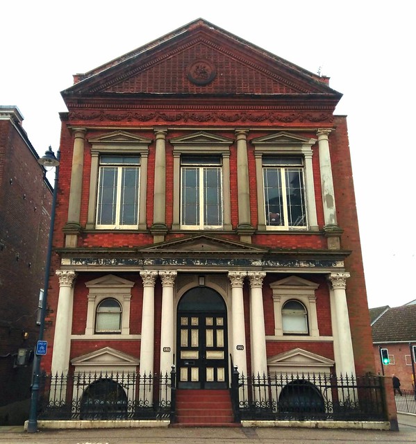 Church rooms to Church of St George, now a furniture showroom and warehouse. 1891 by Charles Baker. Partly rebuilt in 1953. Red brick with York stone and terracotta dressings.