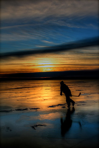 blue light sunset sun reflection hockey minnesota silhouette yellow north reflect skate stick