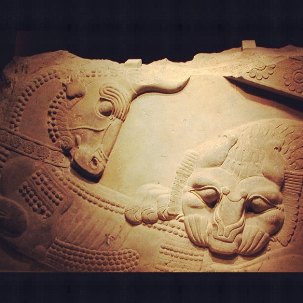 Persian bas-relief of a lion attacking a bull